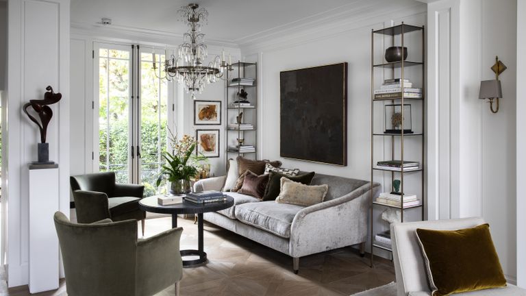 Living room chandelier ideas in a contemporary white room with a traditional candle chandelier