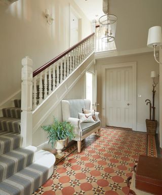 Hallway with staircase runner, hard tiled flooring