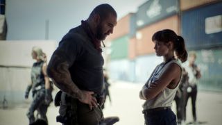 Dave Bautista and Ella Purnell's characters engage in a tense conversation in Netflix's Army of the Dead film