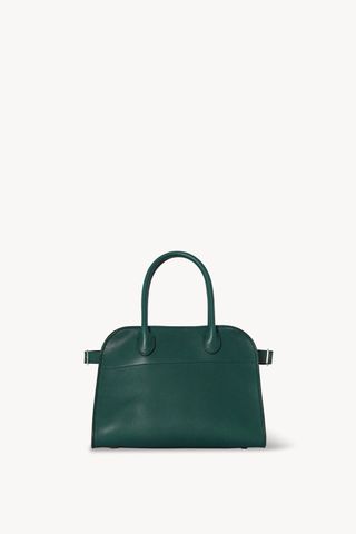 a green tote bag with a top handle