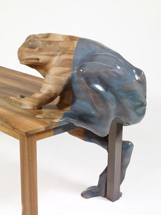 The 'Frog' table is made from French walnut wood and blue transparent enamel