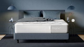 The Casper Original Mattress photographed on a blue-grey bed in a bedroom of the same color
