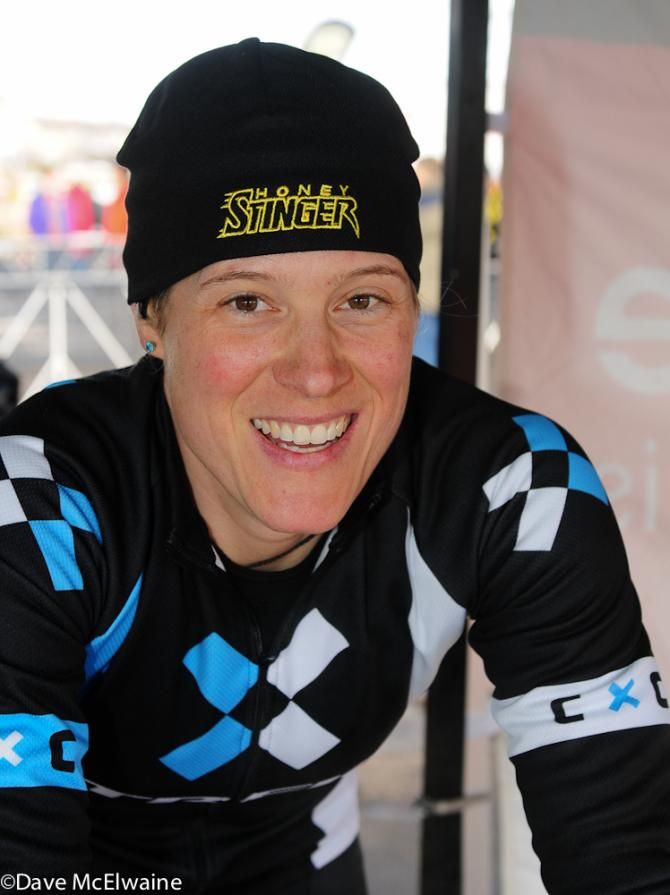 USA Champion Katie Comton watches the racing action from her warm-up tent