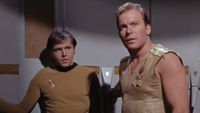Chekov and Kirk in the mirror universe. Kirk has cut sleeves, and Chekov is about to betray him. 