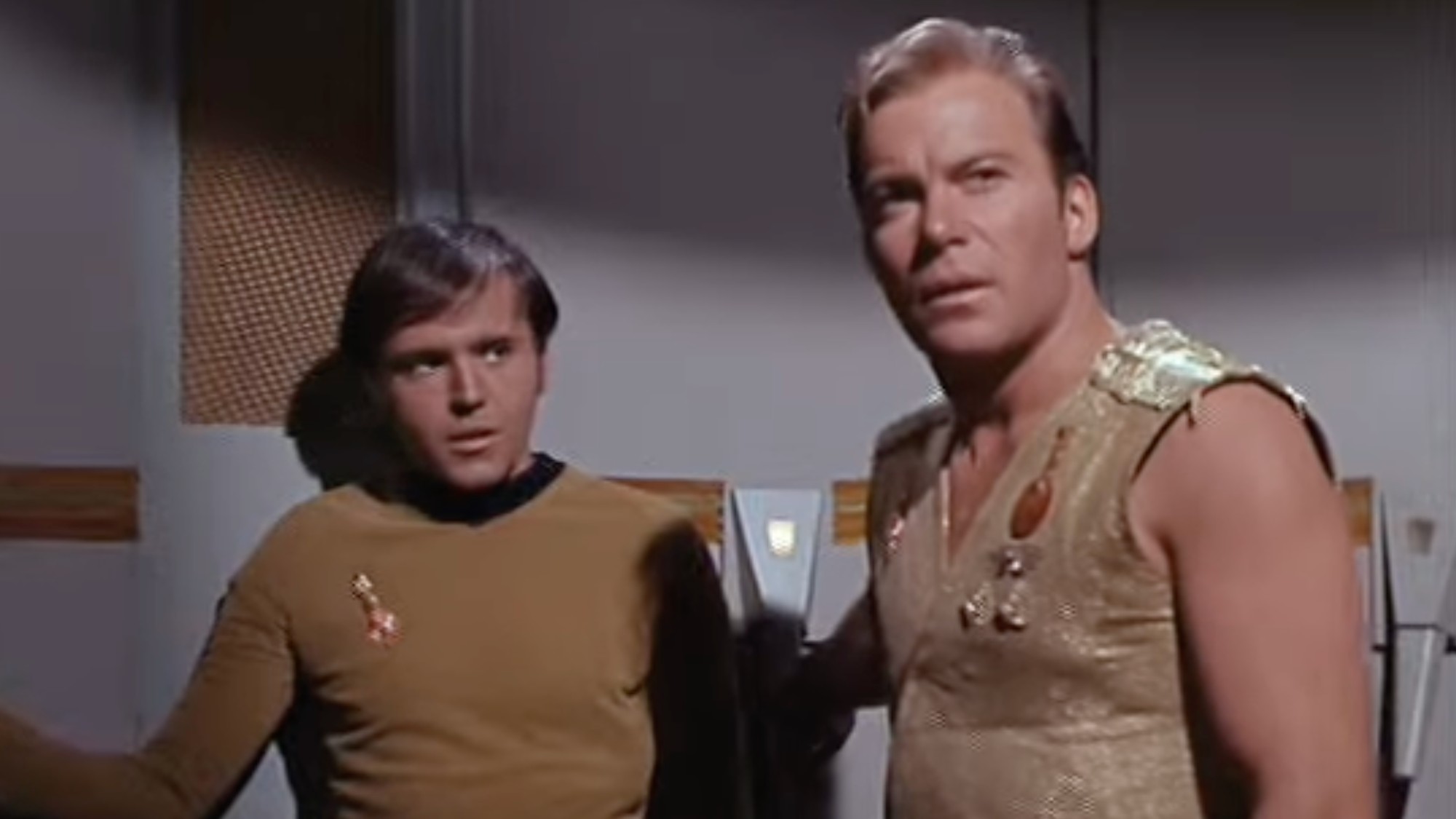 Chekov and Kirk in the mirror universe. Kirk has cut sleeves, and Chekov is about to betray him. 