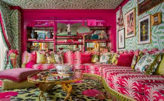 pink living room with large pink sofa