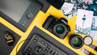 Best graphic design software (Pictured: A desk of cameras and keyboards)