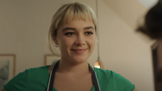 Almut (Florence Pugh) smiles in We Live In Time