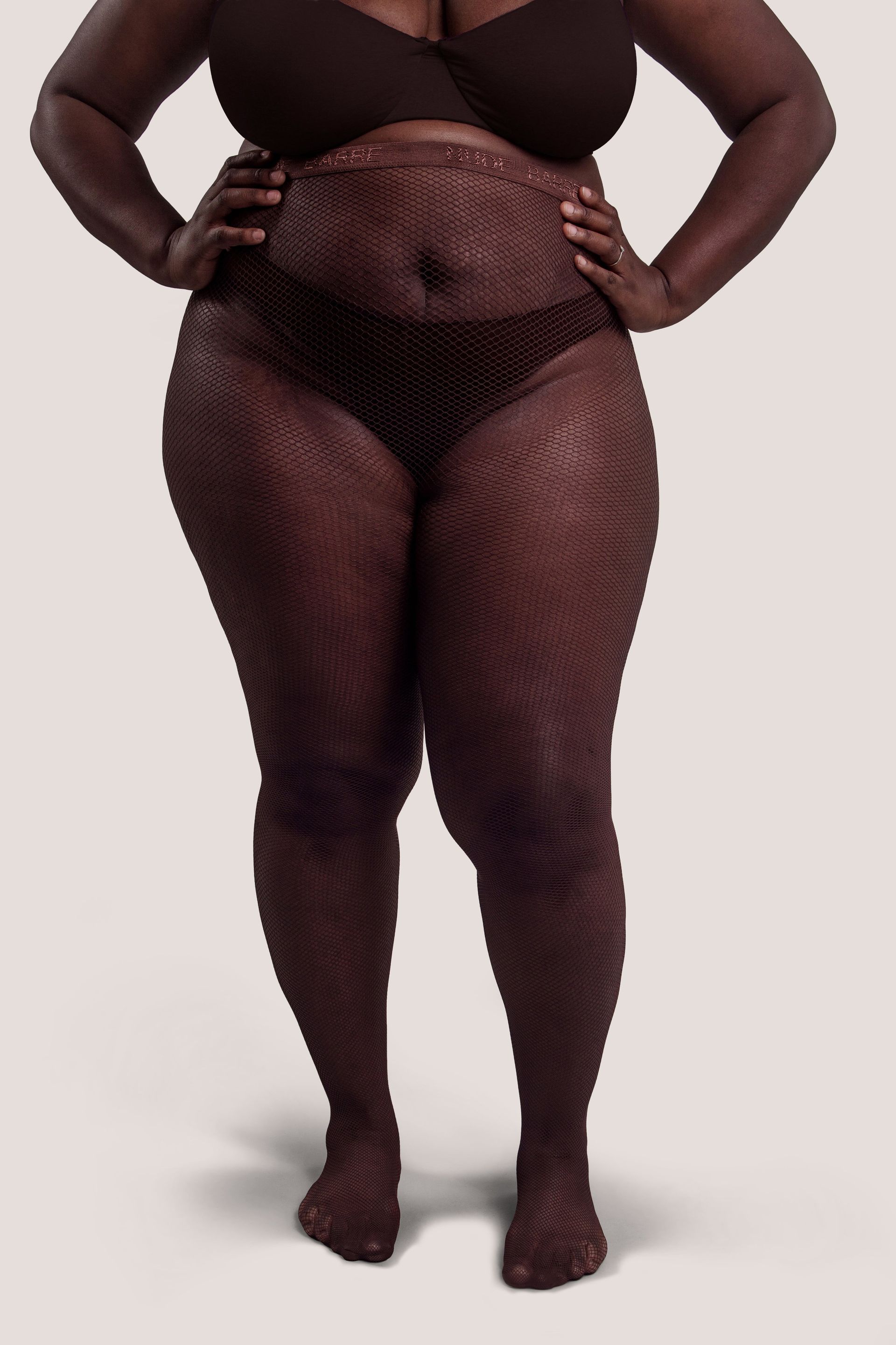 Model wears fishnet tights