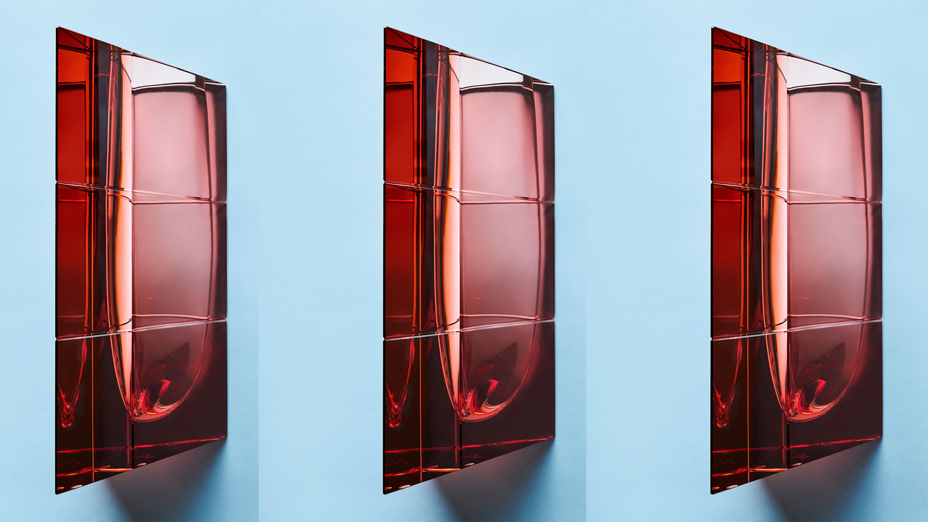 pink glass vase by Moser on blue background