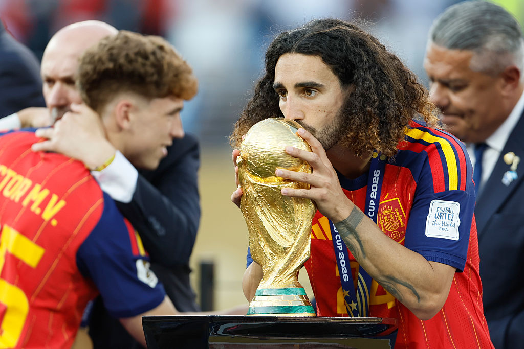 EAST RUTHERFORD, NEW JERSEY - JULY 19: Marc Cucurella of Spain celebrates by kissing the World Cup Trophy after winning the FIFA World Cup 2026 Final match between Spain and Argentina at New York New Jersey Stadium on July 19, 2026 in East Rutherford, United States. (Photo by Richard Sellers/Sportsphoto/Allstar via Getty Images)
