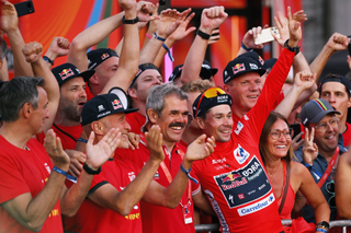 Denk celebrates with Primož Roglič after winning the 2024 Vuelta a España