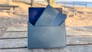 Asus Zenbook 17 Fold OLED review unit in carrying sleeve on picnic table