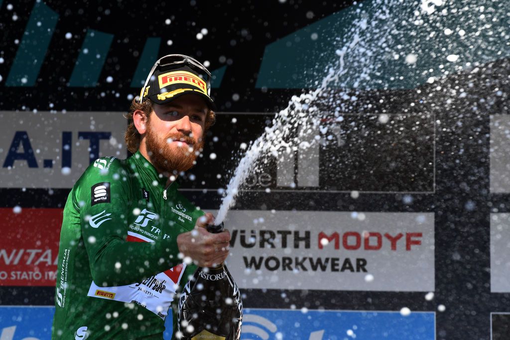 SAN BENEDETTO DEL TRONTO ITALY MARCH 13 Quinn Simmons of United States and Team Trek Segafredo Green Mountain Jersey celebrates at podium during the 57th TirrenoAdriatico 2022 Stage 7 a 159km stage from San Benedetto del Tronto to San Benedetto del Tronto TirrenoAdriatico WorldTour on March 13 2022 in San Benedetto del Tronto Italy Photo by Tim de WaeleGetty Images