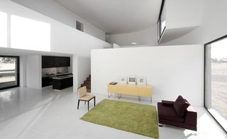 interior is smooth, cool and calm, in stark contrast to the rough concrete texture of the exterior