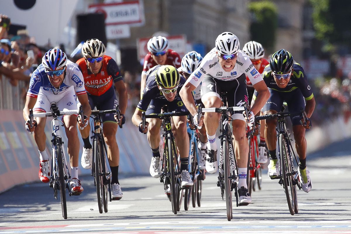 Adam Yates tries to come around in the sprint for stage 15