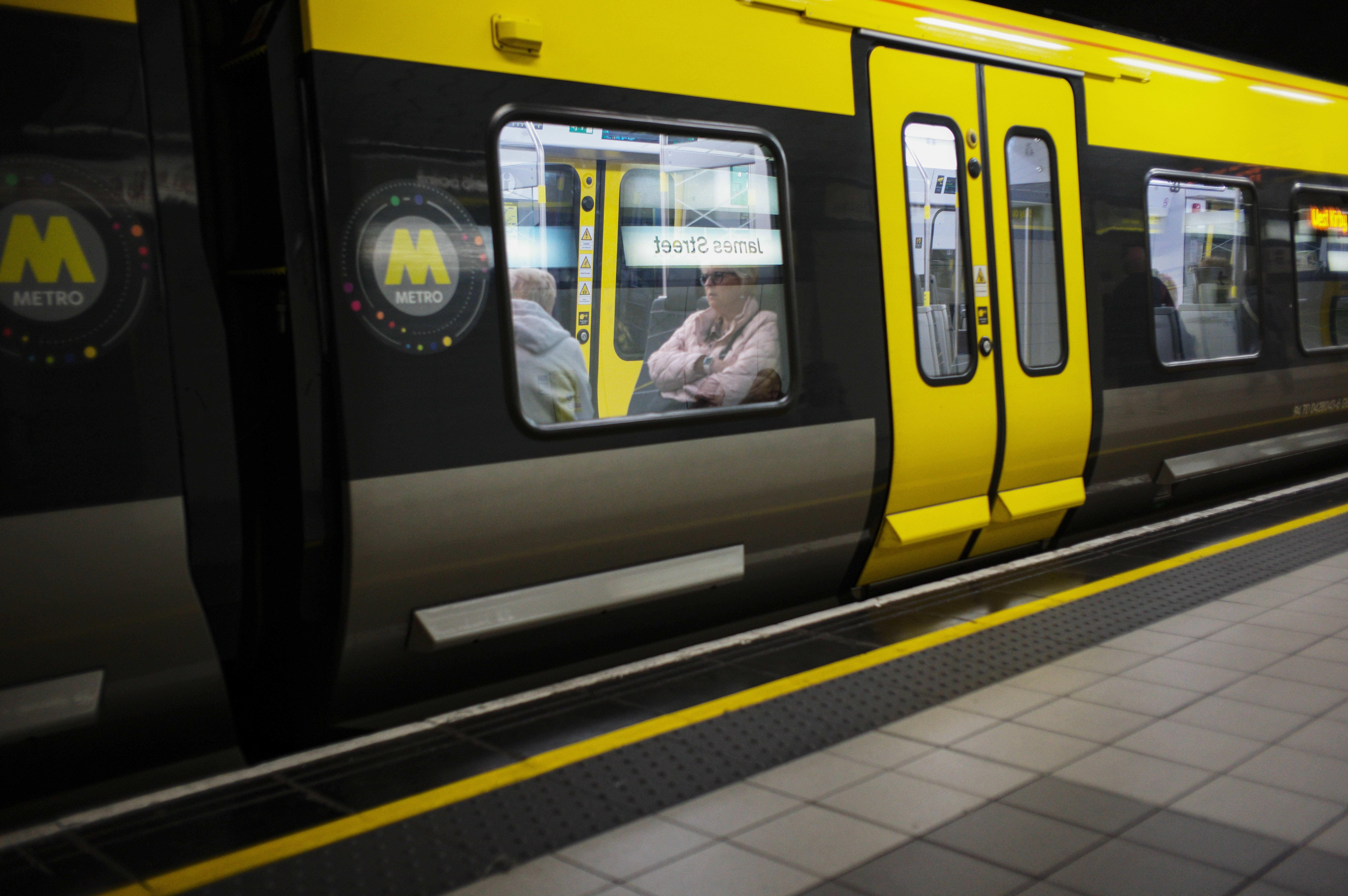 People riding the Liverpool Metro train