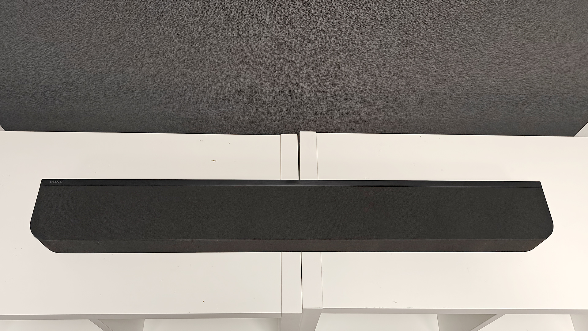 Sony Bravia Theatre Bar 7 + S soundbar package on white shelving unit