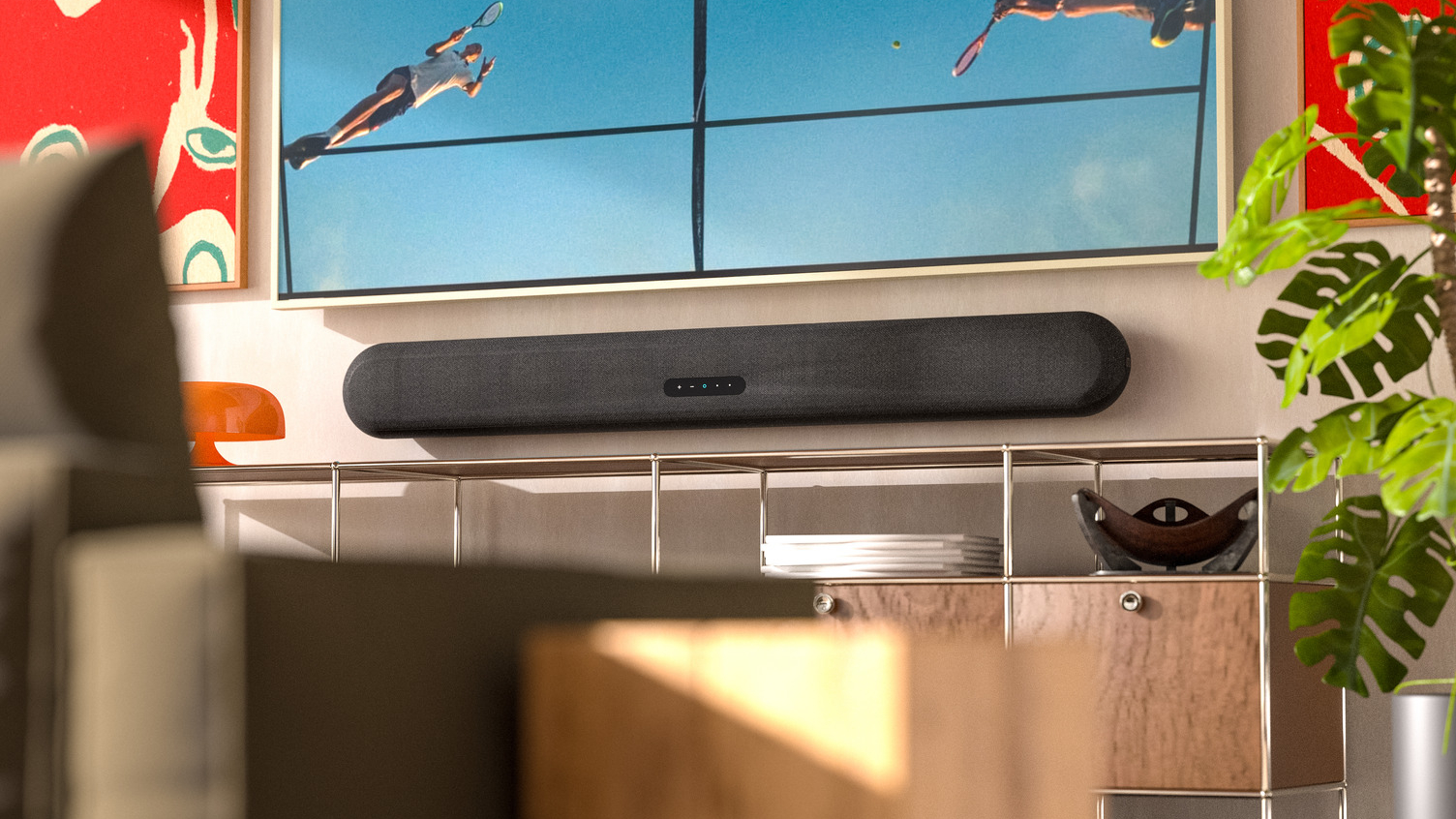 Bluesound soundbar wall-mounted under a TV