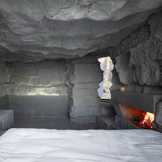 bed fireplace inside boulder