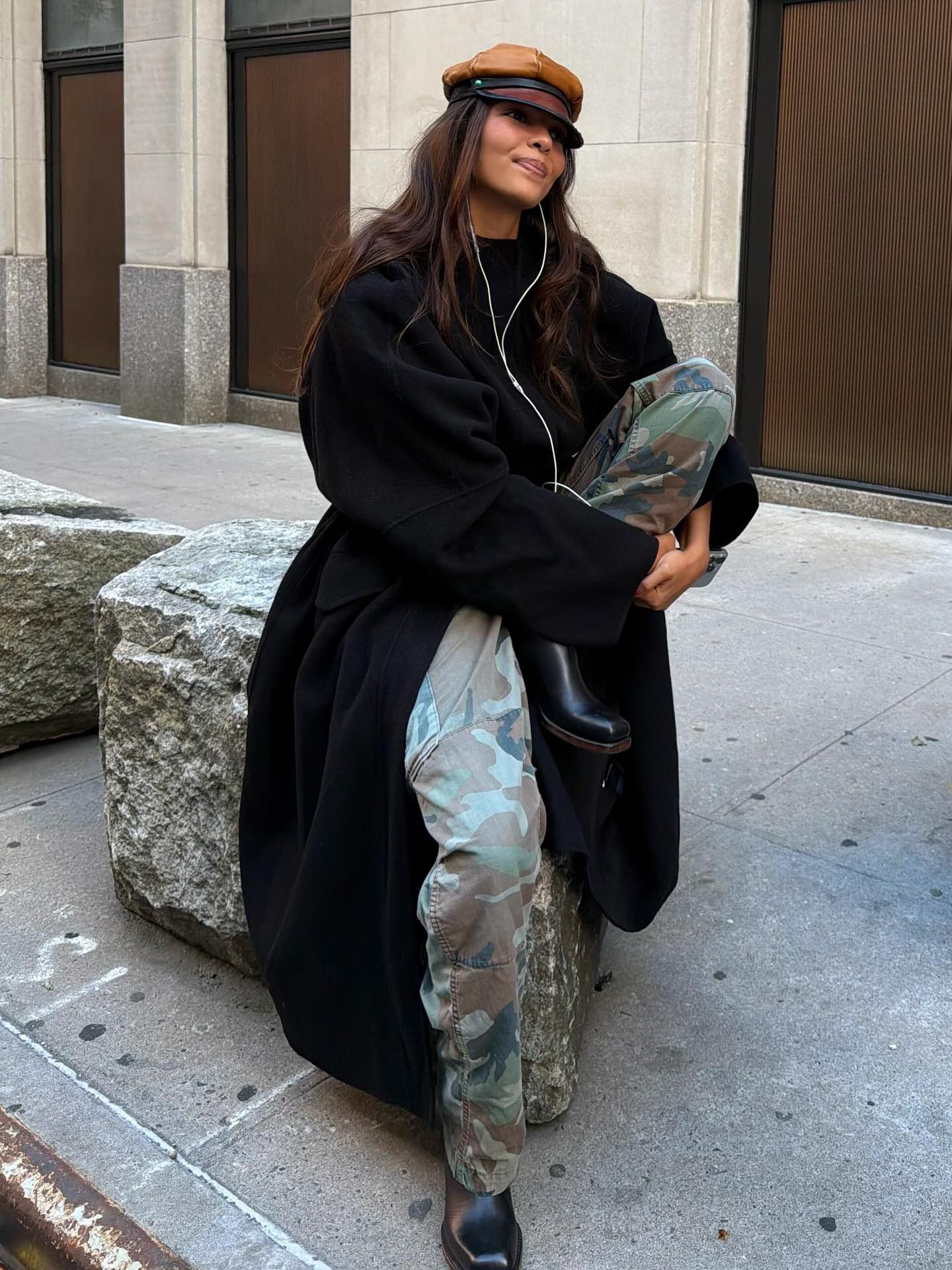 Fashion person Sandra Shehab wears the camo print trouser trend.
