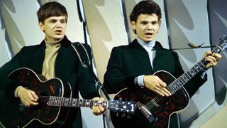 L-R: Phil Everly and Don Everly playing signature J-180 flat-tops in the early '60s