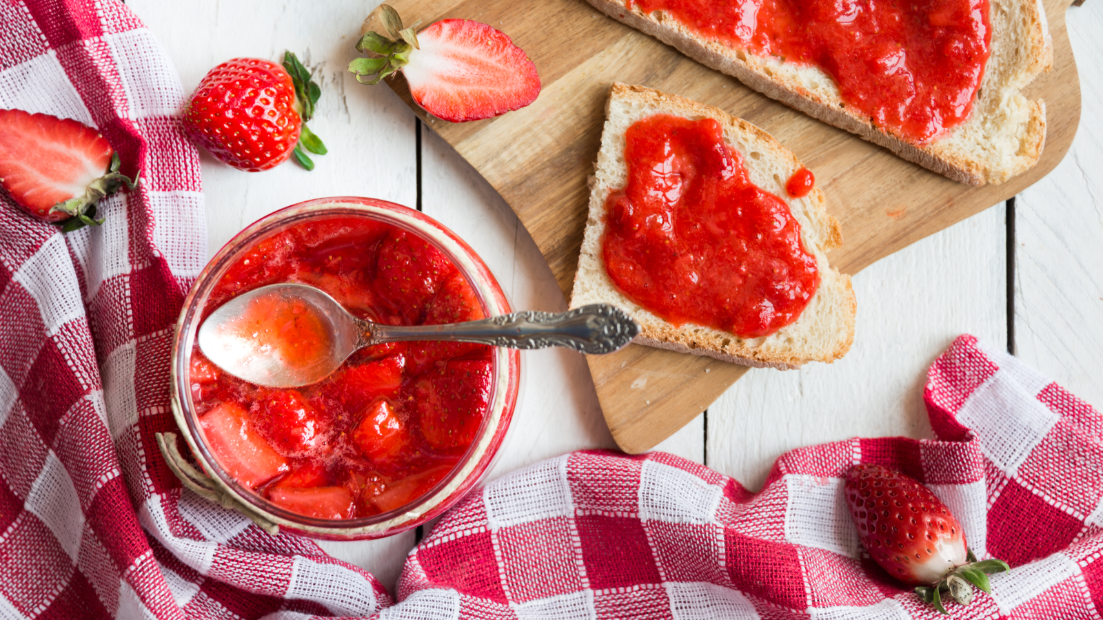Strawberry jam with toast and gingham cloth