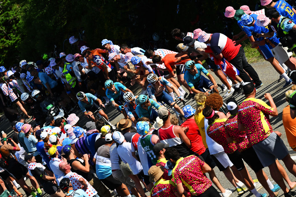 Astana and DSM riders race up the Plateau de Beille to beat the time cut