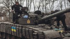 Ukrainian tankers carry out maintenance on their tanks on the Donbass frontline 