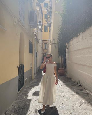 Amalfi coast shopping picks: @maddibriell wears a white dress