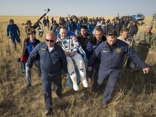 Expedition 36 Flight Engineer Smiles After Landing