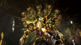 Still from the video game Borderlands 4. You, the player, are firing a gun at a giant golden mech/cyborg that is surrounded by toxic-looking planet spores.