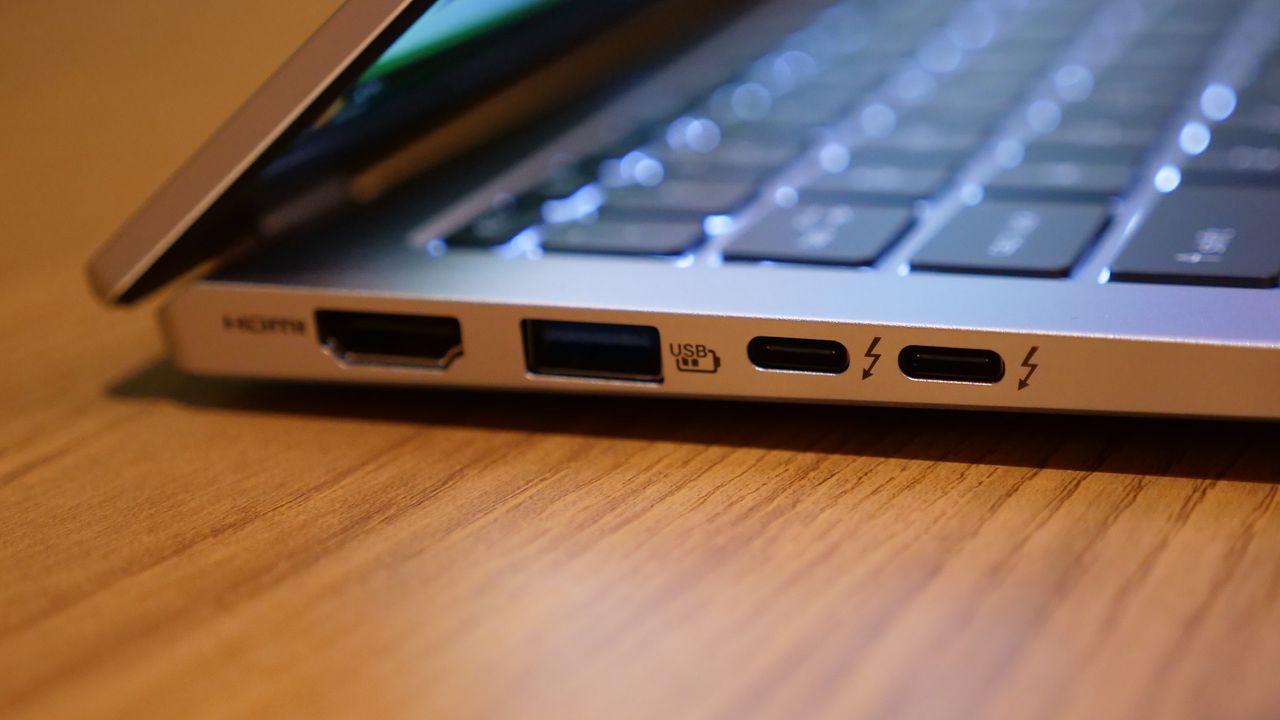Acer Swift 14 Go (2025) on a wooden tabletop.