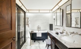 Black and white bathroom with marble walls