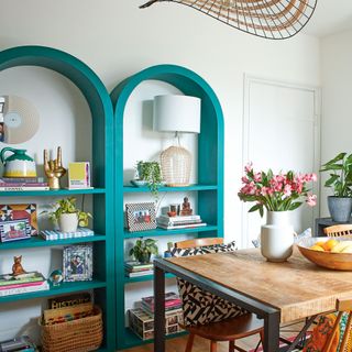 Kitchen with rounded arched open shelving painted