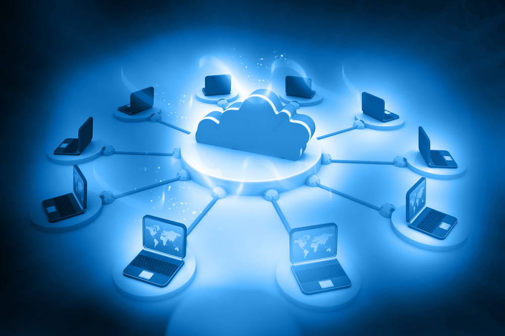 graphical illustration of a cloud at the center of a bank of laptops