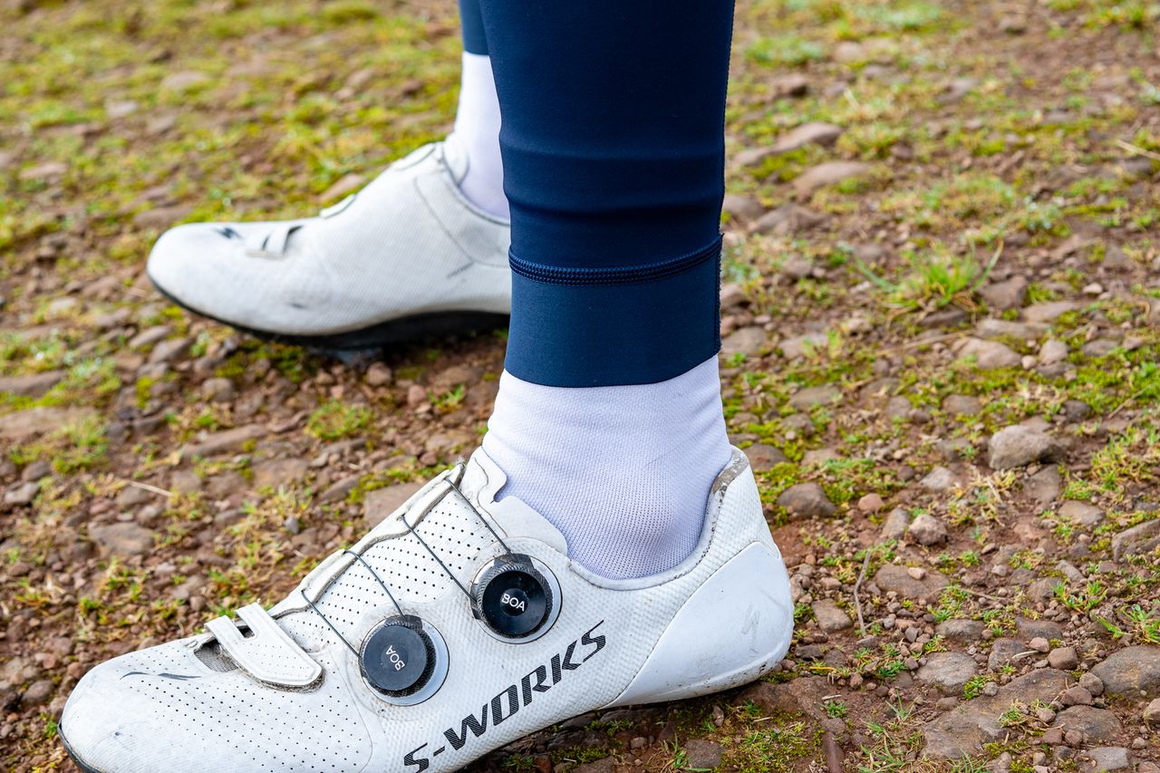 A man wearing a pair of Rapha Pro Team Lightweight bibtights