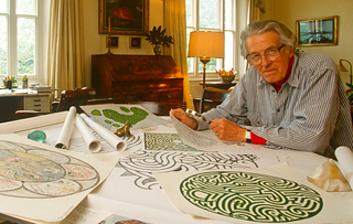 Randoll Coates at his desk designing a maze