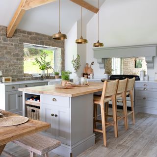 kitchen island with wooden chairs in rustic kitchen