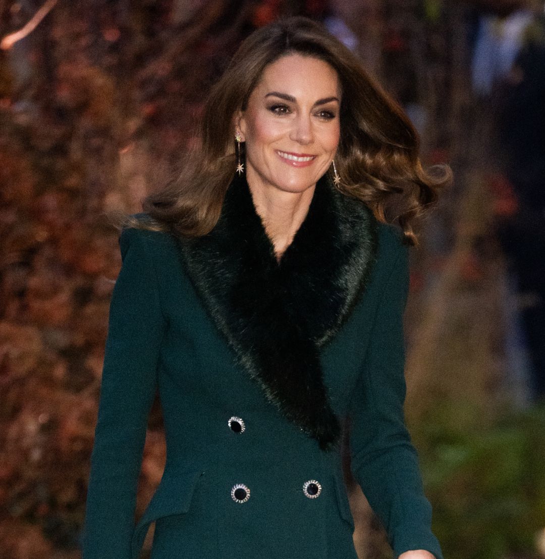 Kate Middleton wearing a green fur trimmed coat