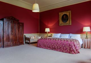 bedroom with pink wall and photo frame