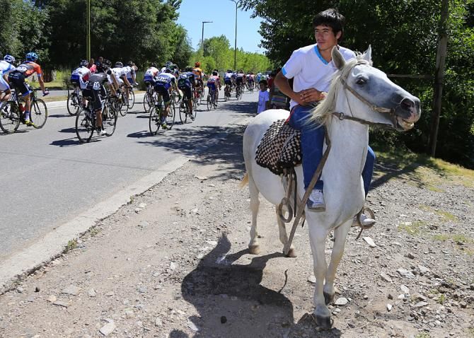A local cowboy watches the race