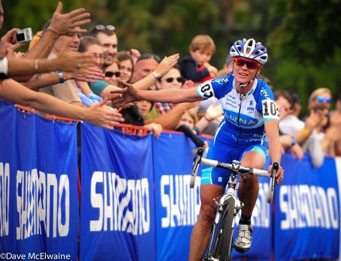 Katerina Nash offers a muddy hand to the crowd in Providence, Rhode Island as she swept the race weekend there.