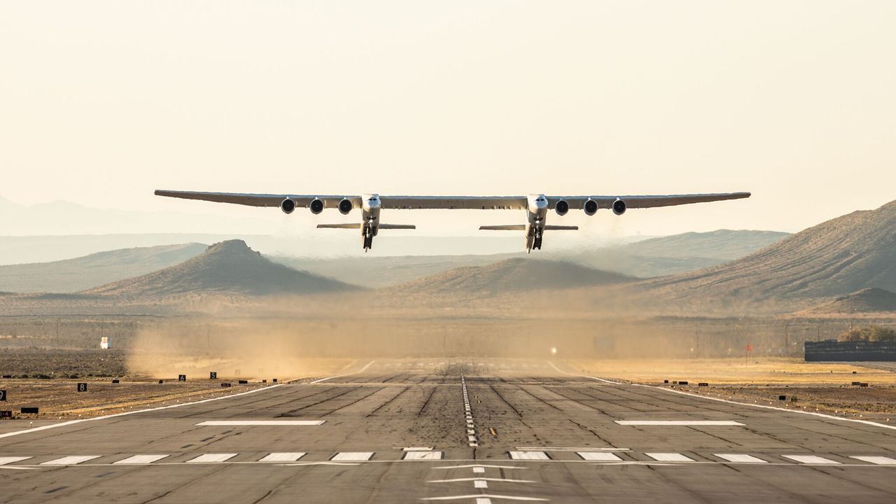 Stratolaunch's rocket carrier plane, the largest aircraft ever built, takes off from the Mojave Air and Space Port in Mojave, California during its first test flight on April 13, 2019.