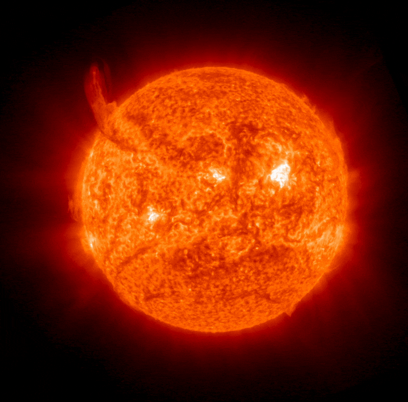 a gif animation showing a huge fiery tendril filament erupting from the upper left corner of the sun.