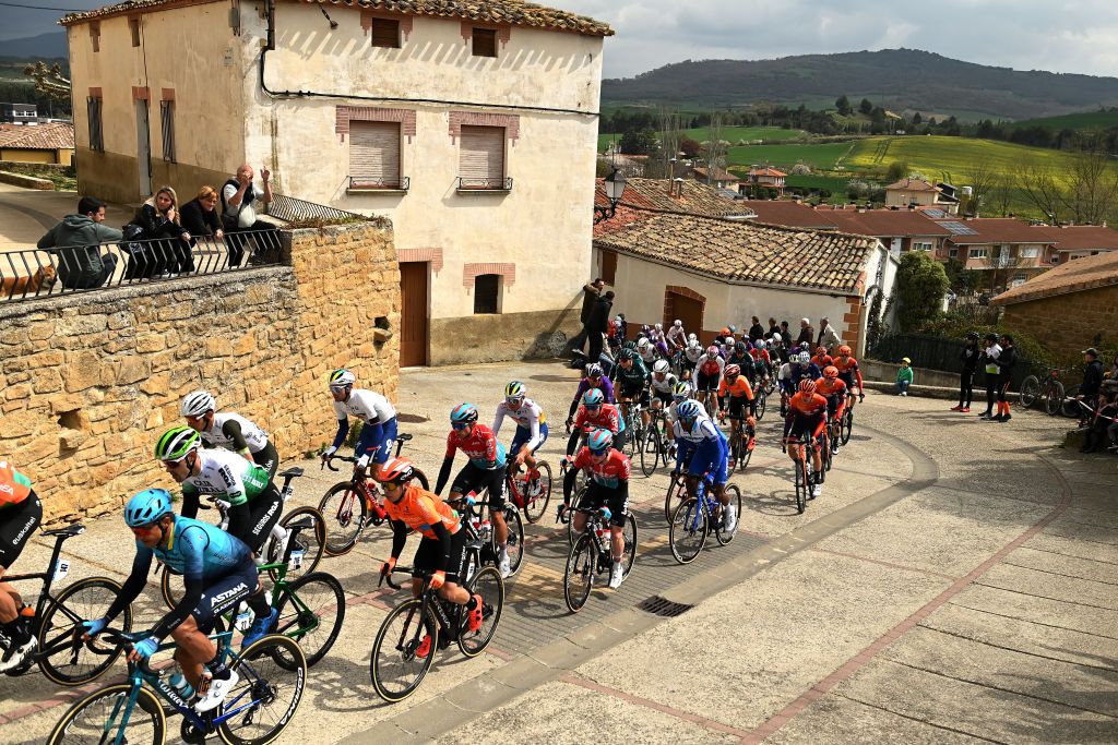 ESTELLA SPAIN APRIL 01 A general view of the peloton passing through a village compete while fans cheers during the 32nd Gran Premio Miguel Indurain 2023 a 2032km one day race from Estella to Estella GPIndurain on April 01 2023 in Estella Spain Photo by David RamosGetty Images