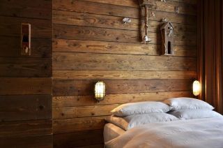 Wood panelled cozy bedroom at Linnen Hotel, Berlin