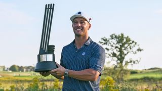 Bryson DeChambeau with the trophy after winning the LIV Golf Chicago tournament