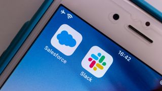 The Salesforce and Slack apps on an iPhone screen