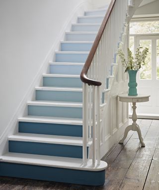 Staircase paint idea by Crown using different shades of blue in ombre effect
